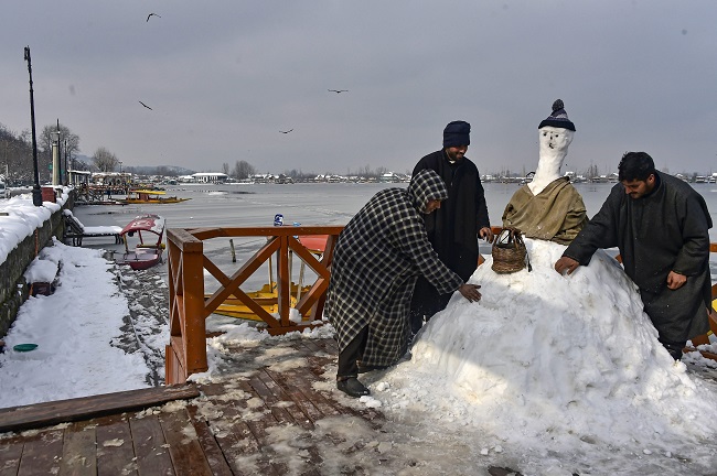 Kashmiris make a snow man at the banks of Dal Lake in Srinagar, after heavy snowfall. (Representative Photo: PTI)