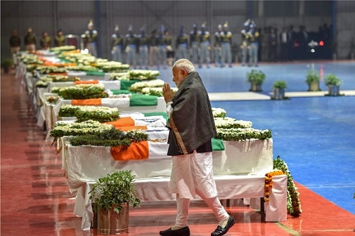 Prime Minister Narendra Modi pays tribute to the CRPF jawans who were martyred in the February 14 terrorist attack at Pulwama in Kashmir. (Photo: PTI)