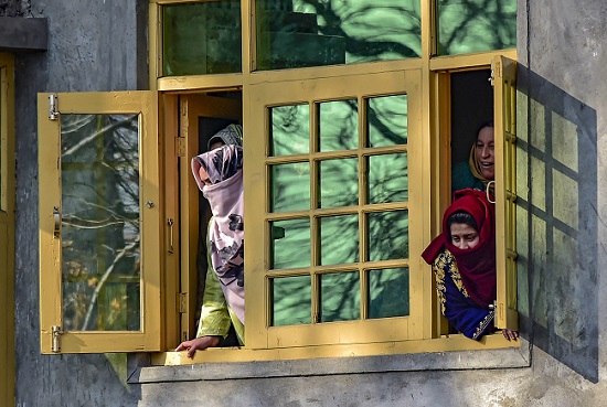 Kashmiri women look through a window in Pulwama, South Kashmir. (Representative Photo: PTI)