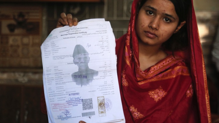 Mahek Liaqat is a Pakistani and married to a Chinese national. In this file photograph, Mahek is showing her marriage certificate. Picture is for Representation Purpose only. (Photo: AP/K.M. Chaudary)