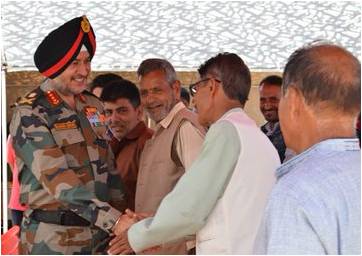 Lt. General Ranbir Singh, Army Commander, Northern Command, interacting with local villagers in North Kashmir on 27 August 2019.