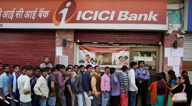 People standing in a queue outside the ICICI Bank. (Photo: AP) -- Representational image