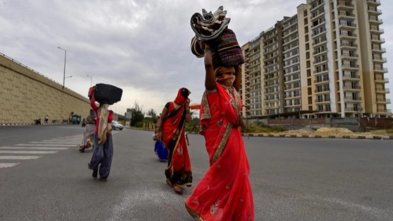 Daily wage earners walking towards their villages. Lakhs of such migrant workers were willing to walk several hundreds of kilometers after the lockdown was announced. (Photo: PTI)