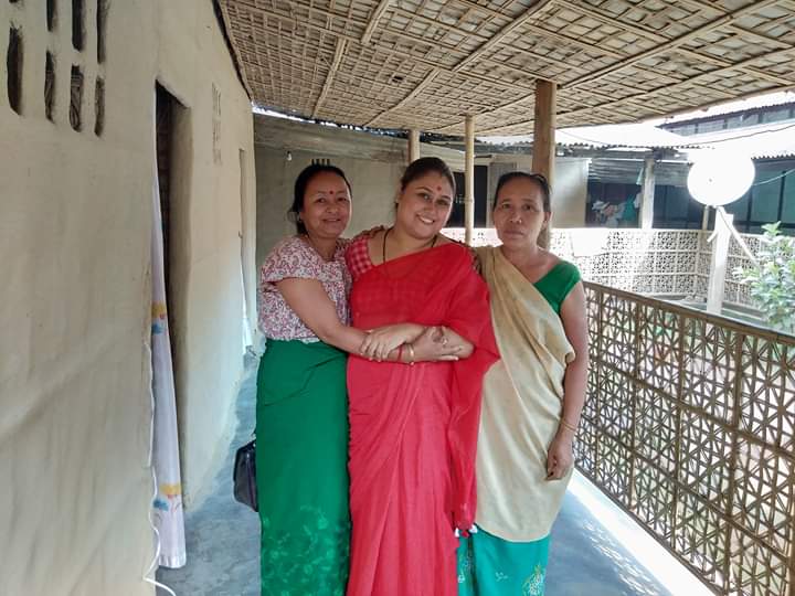 Ananya Paul Dodmani (centre, in red sari) along with tribal women.