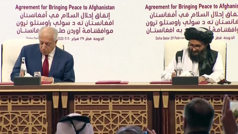 Zalmay Khalilzad, US Special Representative for Afghanistan and Mullah Abdul Ghani Baradar, Taliban's senior commander signing the US-Taliban peace agreement at Doha.