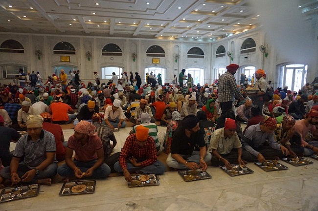 Devotees at the Langar in a Gurdwara