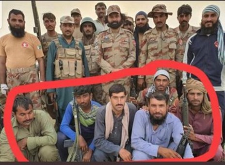 Major Nadeem Abbas Bhatti (standing in centre) with members of his ‘Death Squad’ (encircled in red). These 'Death Squad' members are seated with weapons supplied by the Pakistan Army. Two men (seated second from left and on extreme right) are holding Pakistan Army issued H&K G3 Rifles while another person (seated second from right) is armed with an H&K MP5 sub-machine gun.  