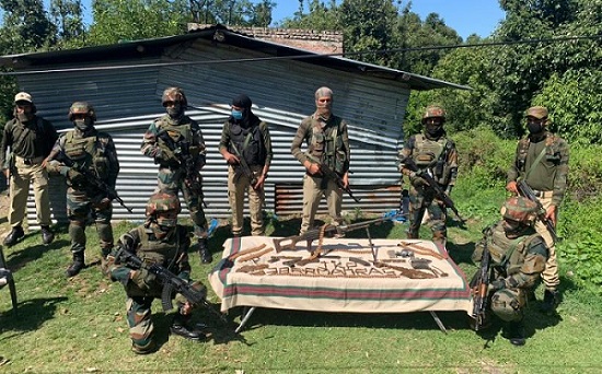 Indian security forces along with rifle and ammunition recovered from the terror hideout in Rajouri. (Photo: News Intervention)