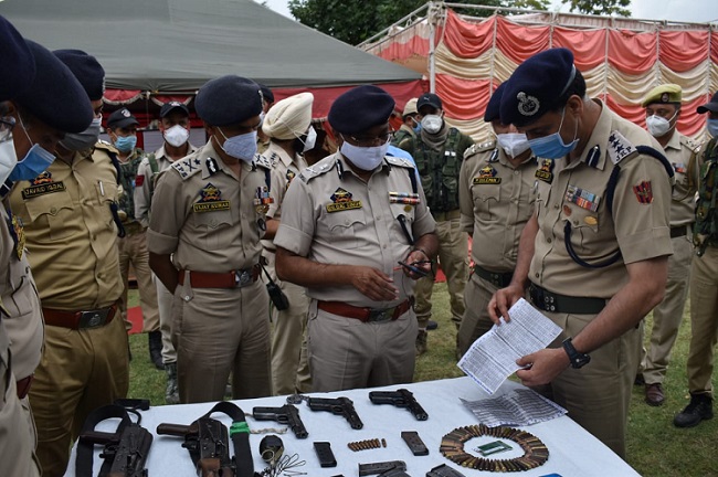 J&K Director General of Police Dilbag Singh and other senior police officers inspect the cache of arms recovered from slain Lashkar-e-Taiba terrorist in Handwara on Thursday. (Photo: News Intervention)