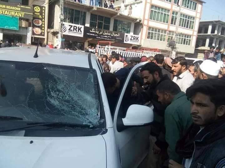 Locals smash the windscreen of ISI agent's car in Rawalakot, Pakistan-occupied Kashmir (POK). (Photo: News Intervention)