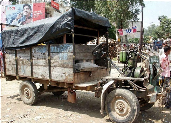 Jugaad vehicle in North India. This 'jugaad' is made by attaching a pumpset engine to a steel frame with four wheels. It's a common mode of transport in rural areas.