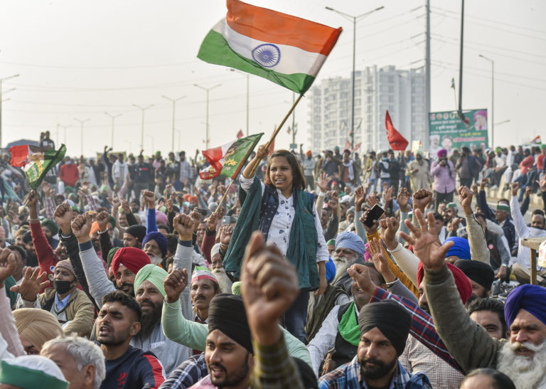 Farmers raise slogans during their protest against the Center's new farm laws at Ghazipur border in New Delhi, on December 24, 2020. (Photo: PTI)