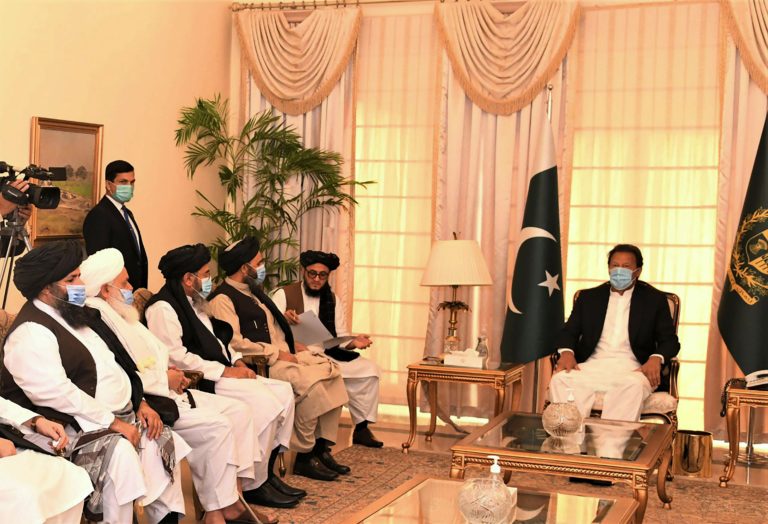 Pakistan Prime Minister Imran Khan along with Taliban co-founder Mullah Abdul Ghani Baradar and his delegation during their meeting in Islamabad on December 18, 2020.