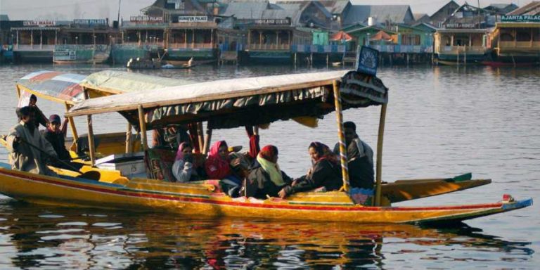 Tourists enjoying the Shikara ride in Dal Lake, Srinagar. (Photo: PTI)