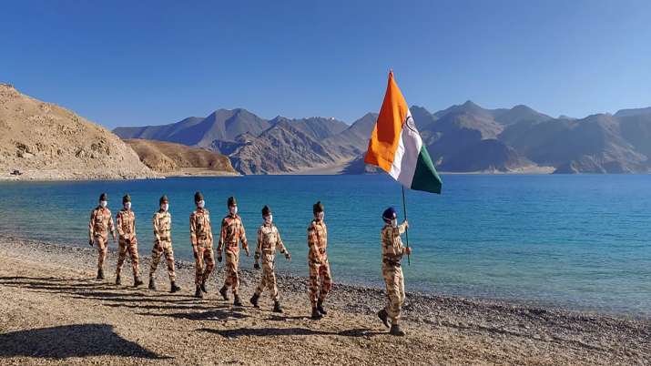 Indian soldiers hoist the tricolor at the Pangong Tso Lake, eastern Ladakh. (Photo: PTI)