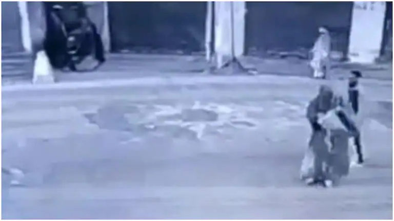 CCTV footage of 38 year old Haseena Akhtar hurling petrol bomb at a CRPF post at Sopore, Jammu & Kashmir. (Photo: CCTV Screengrab)